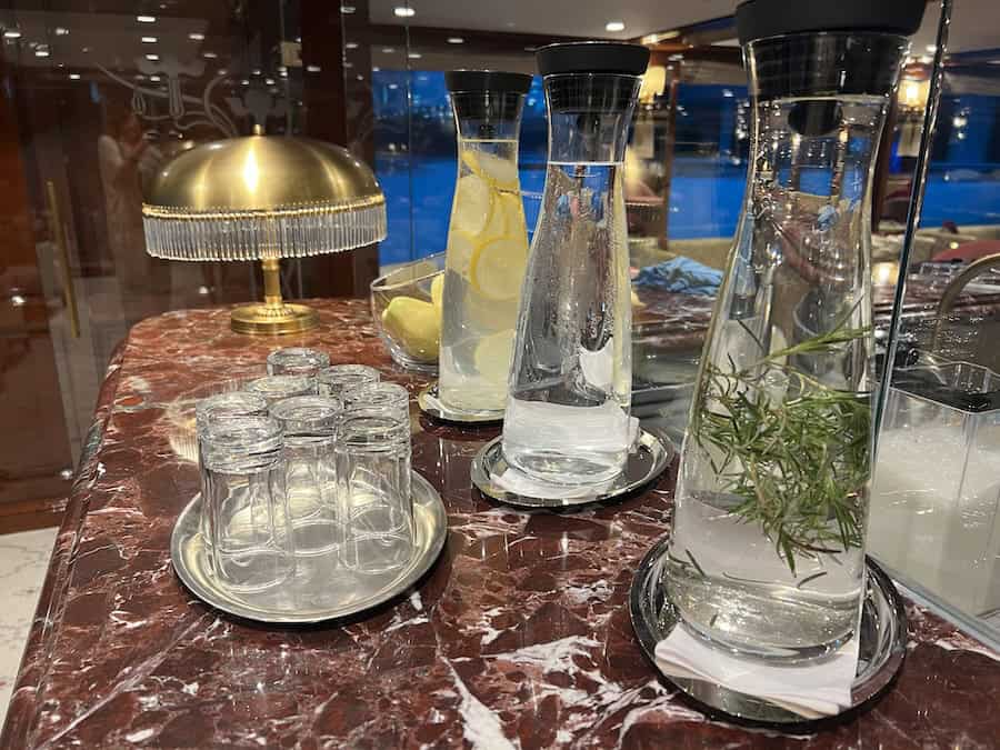 Cruising The Capital Cities Of The Danube On Uniworld’s Newest Ship (2026 REVIEW) 4 Flavored waters on the elegant bar.