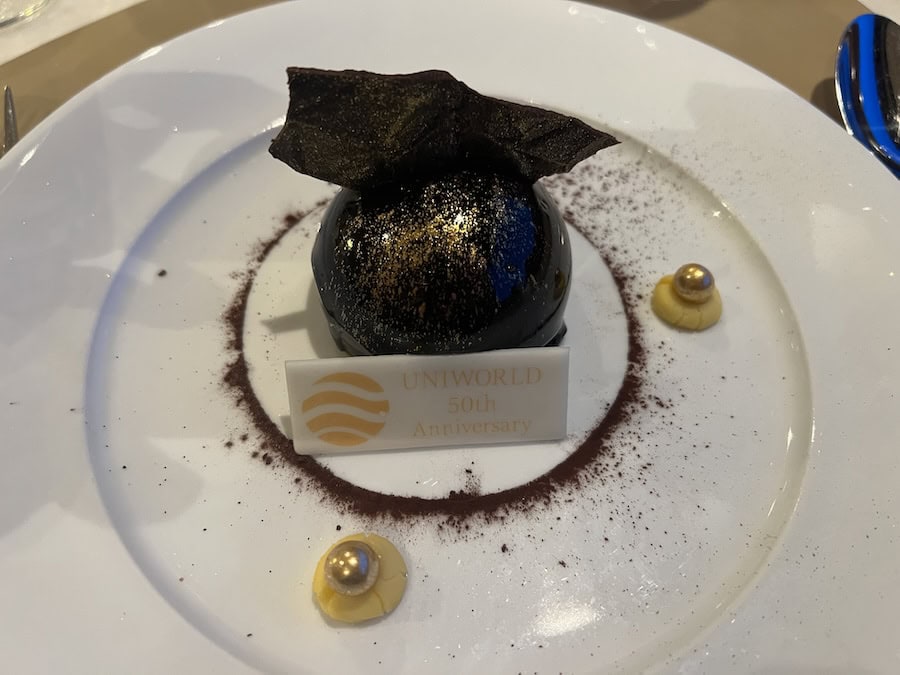 Cruising The Capital Cities Of The Danube On Uniworld’s Newest Ship (2026 REVIEW) 17 The gold dusted gala dessert aboard SS Emile