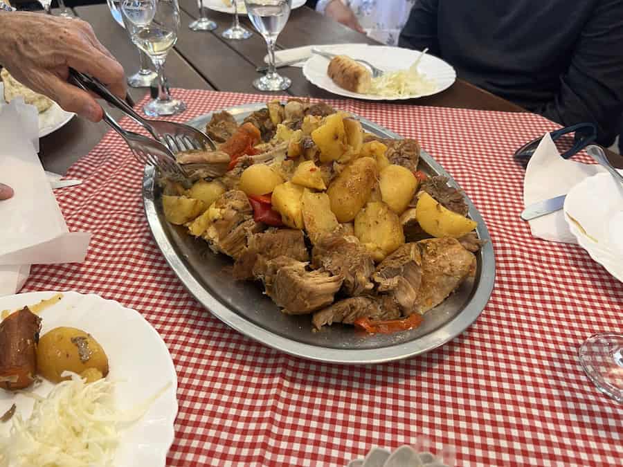 Cruising The Capital Cities Of The Danube On Uniworld’s Newest Ship (2026 REVIEW) 31 Rustic lunch of veal and potatoes on the Vukovar tour
