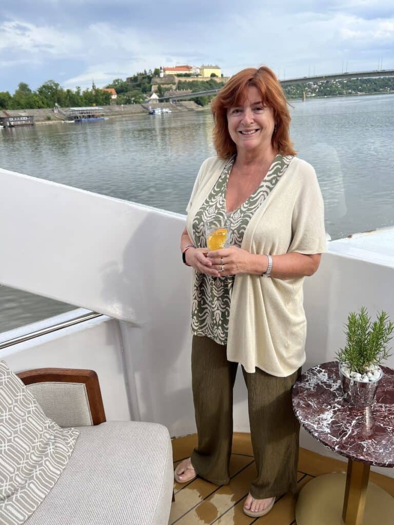 Cruising The Capital Cities Of The Danube On Uniworld’s Newest Ship (2026 REVIEW) 39 The author on deck of the SS Emil